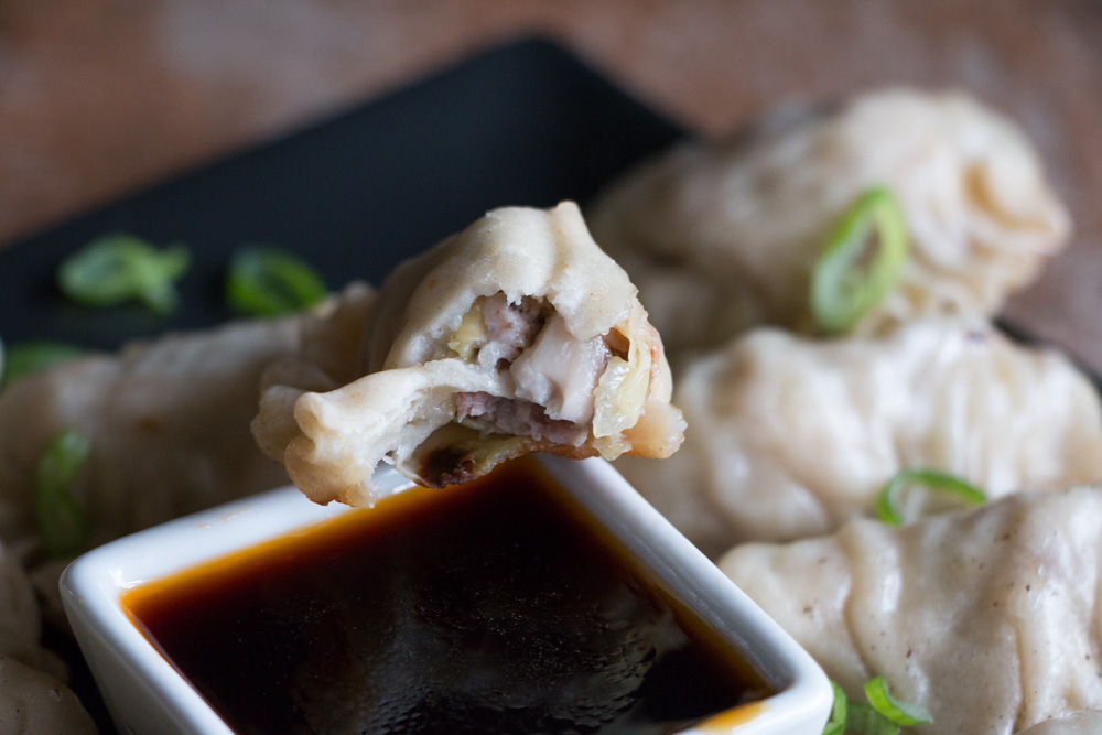 Homemade gyoza make a perfect savory side dish, stuffed with pork, cabbage, mushrooms, and aromatics. While they may seem intimidating to make from scratch, learn how to break them down into easy steps.