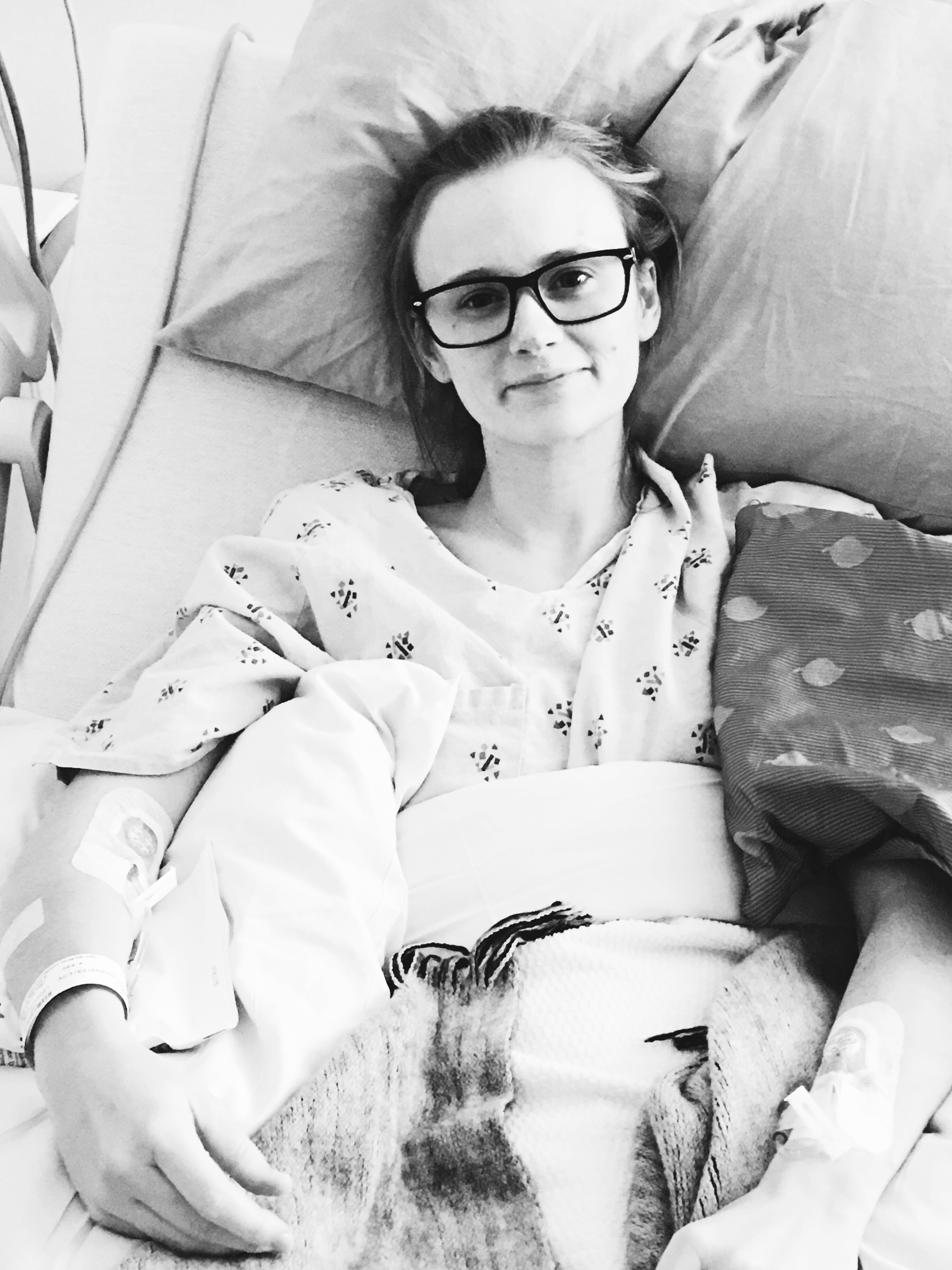 Picture of the author, Megan, in a hospital bed.