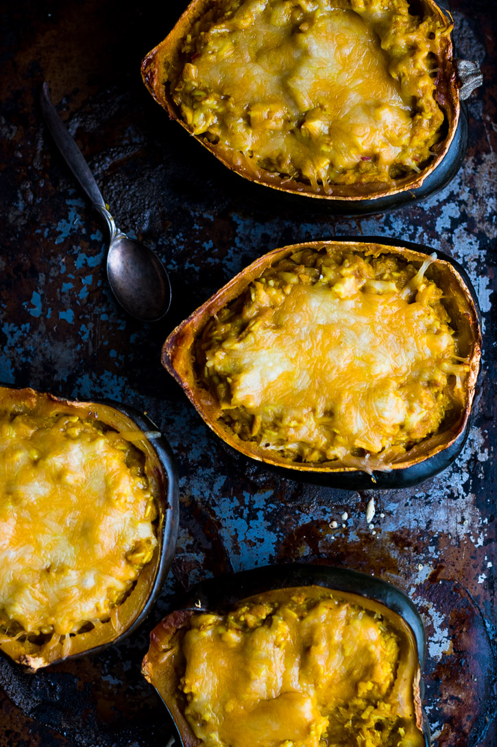 This Twice Baked Acorn Squash with Thai Yellow Curry and Chicken is extremely delicious. Yellow curry, coconut milk, shredded chicken, and jasmine rice all combine in a simple and comforting meal. | www.megiswell.com