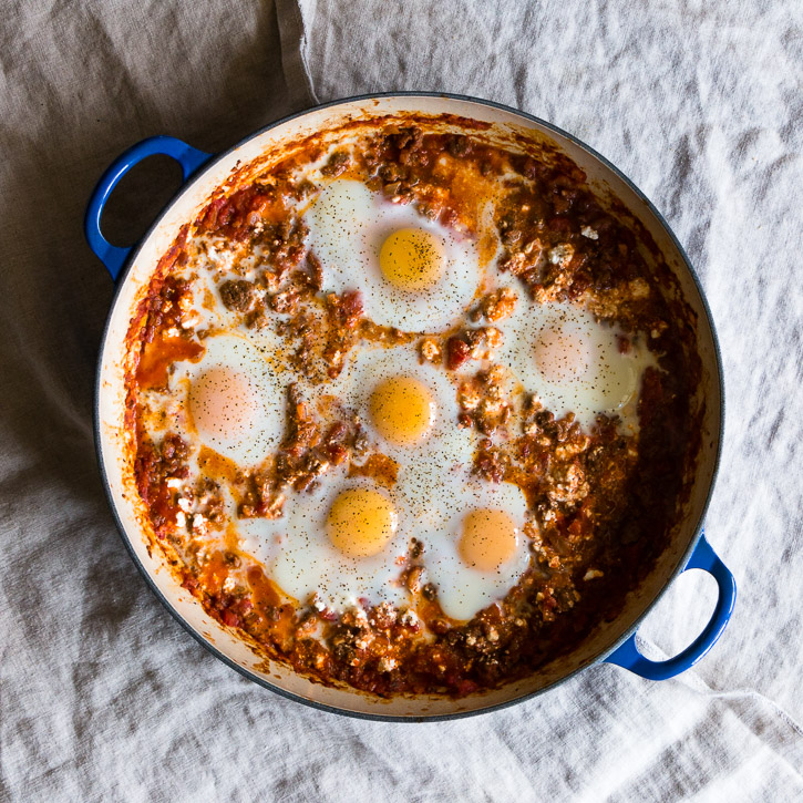 Kimchi Eggs in Hell with Turkey Sausage and Feta is an easy one-skillet remix of a classic. Instead of using pepper spices to get that fiery look and taste, this recipe uses kimchi. | www.megiswell.com