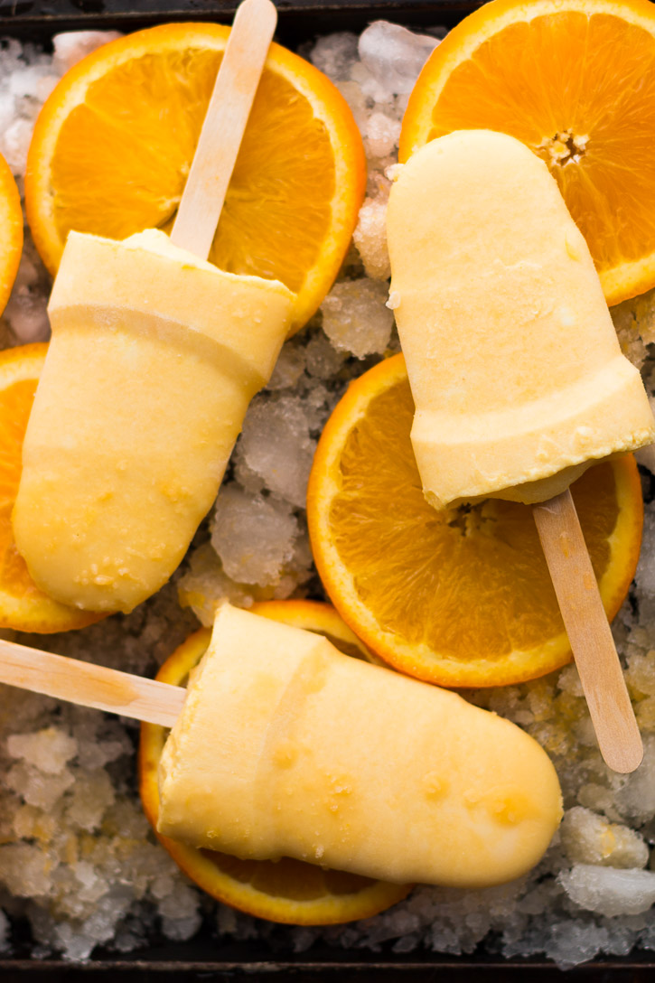 Creamsicle Popsicles with Feta combines the sweetness of fresh oranges and the saltiness of feta to make a perfect summertime treat. | Popsicle Week | www.megiswell.com