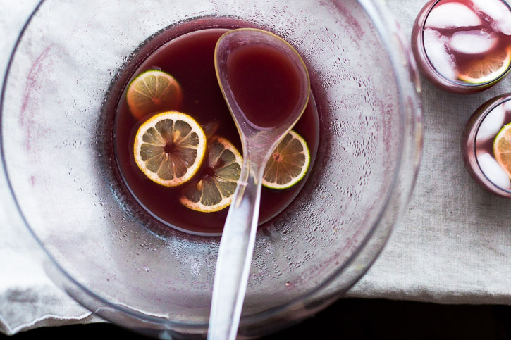 A combo of sour beer, orange juice, and red wine make this Shandy Punch a perfect summer drink for a party. | www.megiswell.com