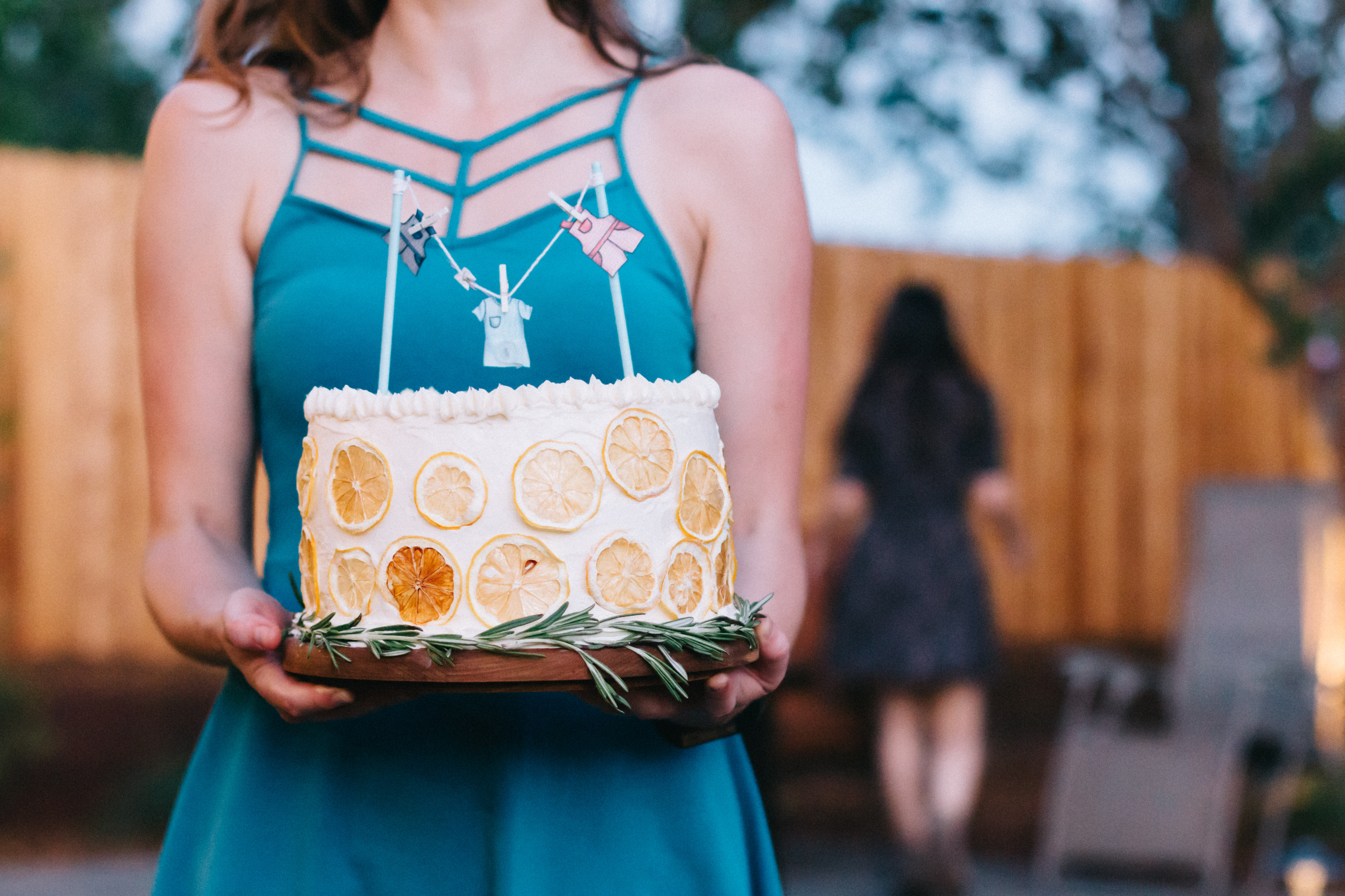 This light and classic Rosemary Sponge Cake is layered with rosemary infused apricot compote and white chocolate buttercream frosting. Dehydrated lemons and rosemary make decoration easy and beautiful. | www.megiswell.com