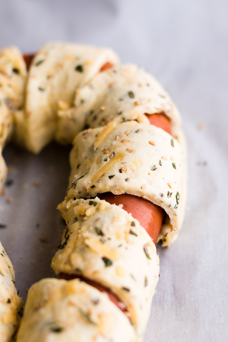 This Puff Pastry Sausage Braid is an easy and impressive looking side or appetizer. Especially when dipped into a Beer Cheese Sauce made with American wheat ale, cheddar, and smoked Gouda for a sweet n’ smoky explosion of flavor. | www.megiswell.com
