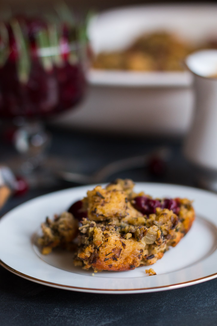 Close up side view of Cornbread and Cranberry Vegetarian Stuffing on a plate.