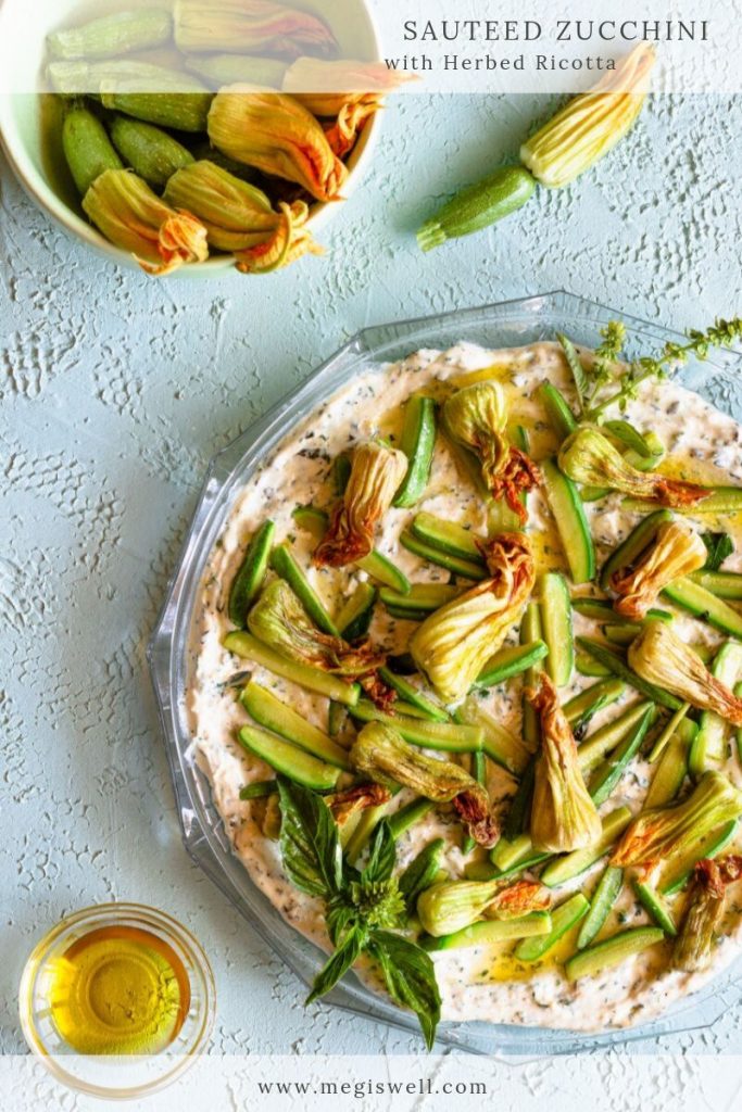 These lightly sautéed zucchini blossoms & baby zucchini served on top of dripped ricotta whipped with olive oil and fresh herbs makes an easy and beautiful summer appetizer or side. #megiswell #meganwellsphotography | www.megiswell.com