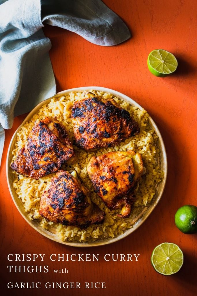 Crispy Curry Chicken Thighs with Garlic Ginger Rice is fragrant and delicious comfort food. The chicken is crisp yet juicy and the rice is good enough to eat on its own. | Thai Yellow Curry Paste | Main Dish | #chickendinner | www.megiswell.com