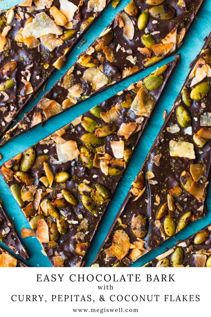 This Easy Chocolate Bark with Curry, Pepitas, and Coconut Flakes is a sweet and savory combo that’s so toasty and warm, you’ll keep coming back for more. #chocolatebark #ediblegift #holidayrecipe #pumpkinseeds | www.megiswell.com