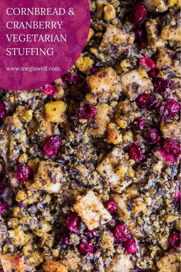 This Cornbread and Cranberry Vegetarian Stuffing is a remake of a Thanksgiving classic. Mushrooms and sage provide savory umami flavor and cranberries bring bright pops of flavor to your mouth. | #vegetarianstuffing #vegetarianthanksgiving #cornbreadstuffing | www.megiswell.com