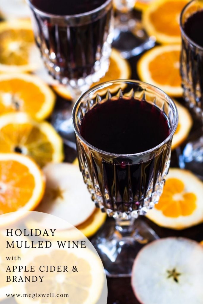 This Holiday Mulled Wine with Apple Cider and Brandy can be made on the stovetop or slow cooker and is perfect for holiday entertaining. | crockpot | #christmas #thanksgiving | www.megiswell.com