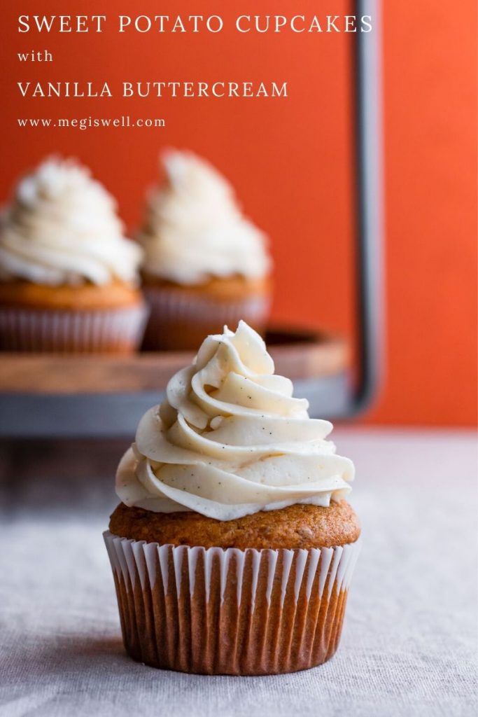 These quick-bread Sweet Potato Cupcakes with Vanilla Buttercream are moist and packed with the fall flavors of cinnamon, ginger, nutmeg, and Chinese 5 spice and are topped with a Swiss meringue buttercream studded with vanilla bean paste. They’re perfect individual sized Thanksgiving desserts! | Friendsgiving | www.megiswell.com